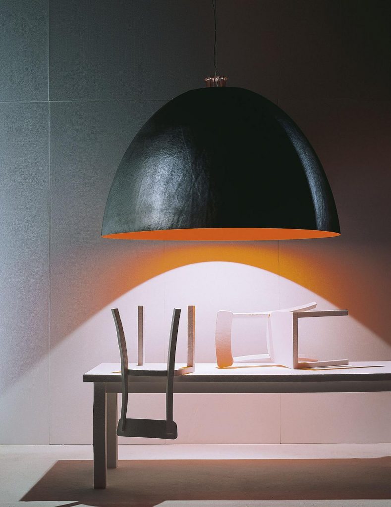 XXL Dome lamp with an orange inside hanging over a table