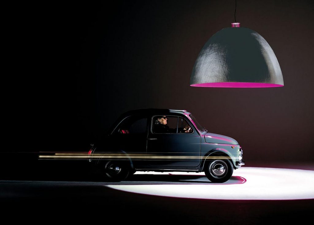 XXL Dome lamp with a purple inside hanging over a car