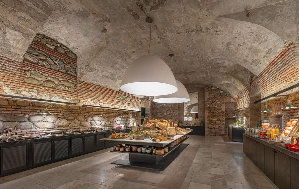 XXL Dome lamp with a white inside hanging over a table in a kitchen setting