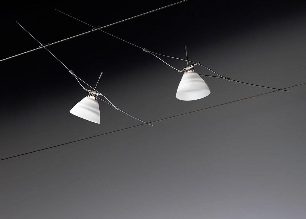 Yayaho Element sixteen lamps hanging from a wire in a dark room