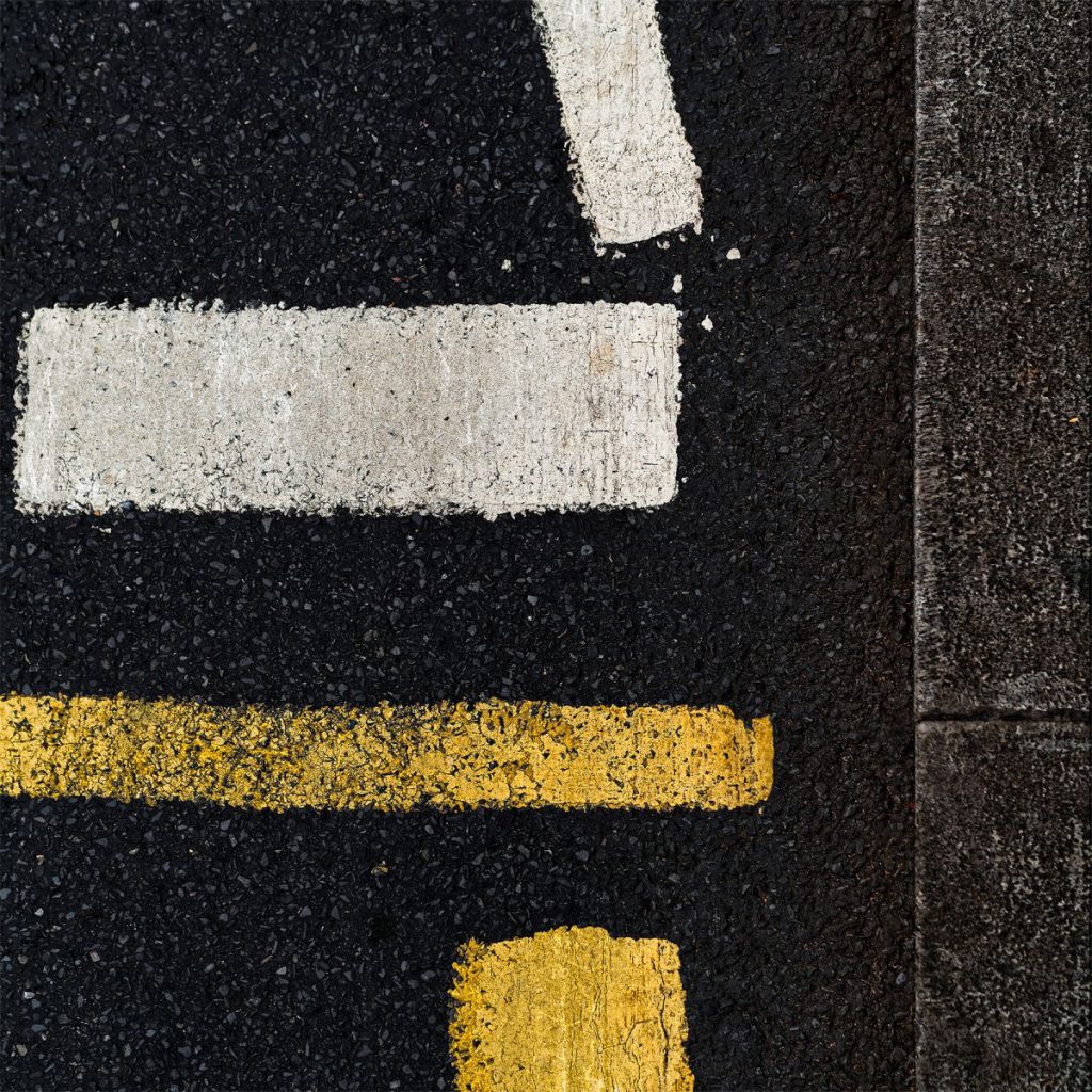 Archival pigment print in shades of yellow and white on black