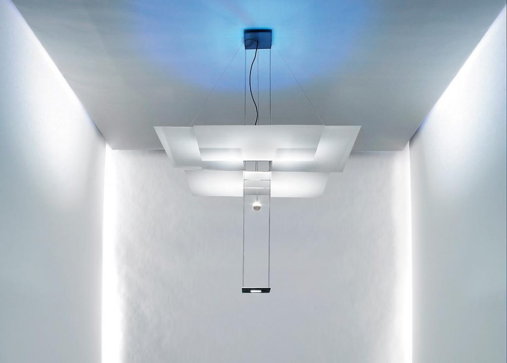 A white room with a Oh Mei Ma hanging from the ceiling