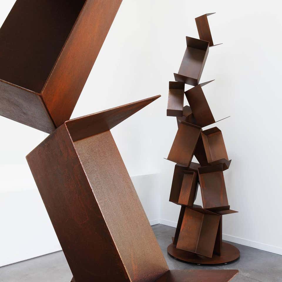 Oxidized iron shelves sculpted in Milan a white background .