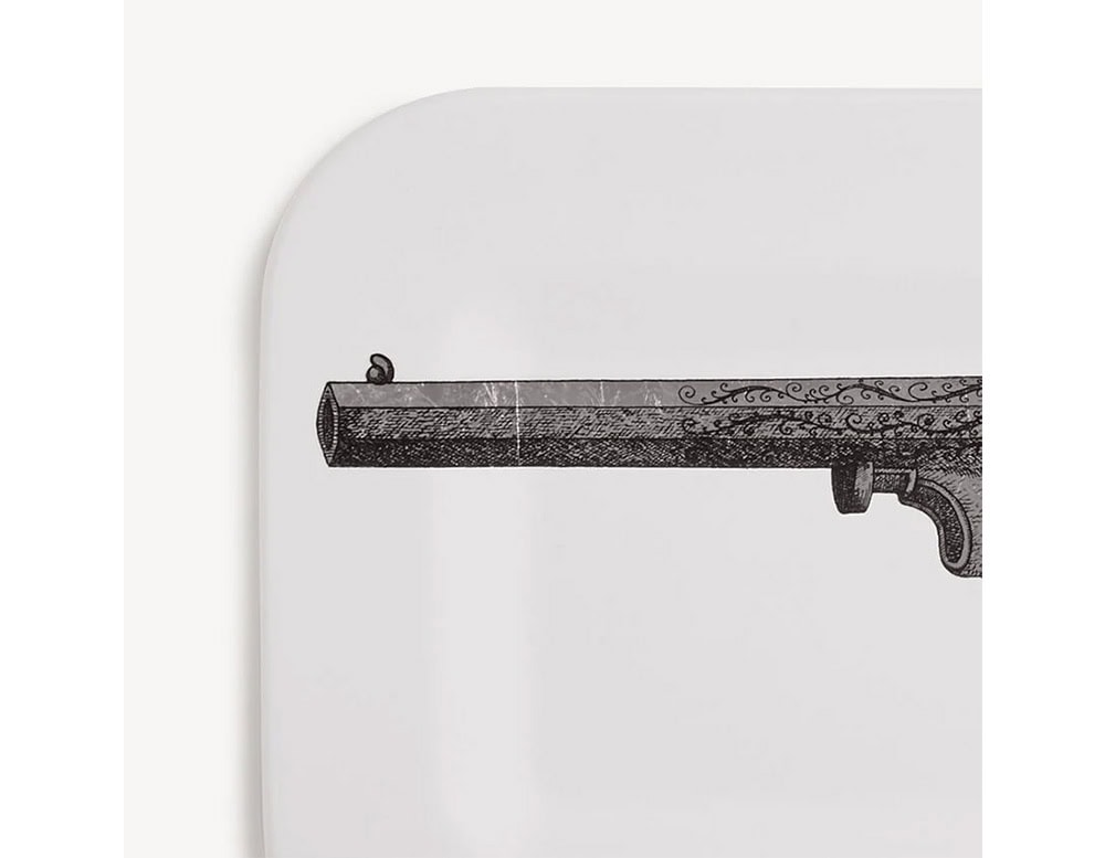Decorative tray with a crisp white surface accented by a finely drawn vintage pistol motif, offering a striking blend of art and utility.