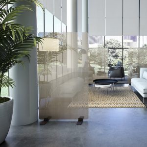 glass partitions resting on black steel base in a room