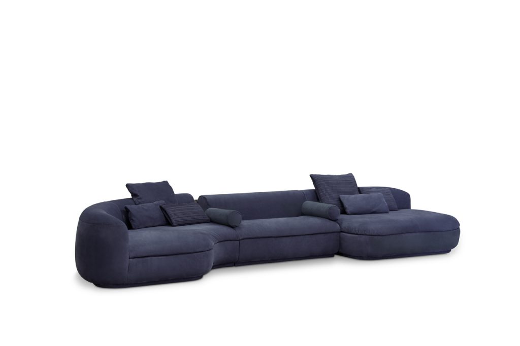 large sectional sofa made of velvet fabric in a purple tone on a white background