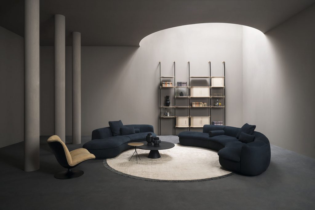 two sofas made of velvet fabric in a dark blue tone in a living room