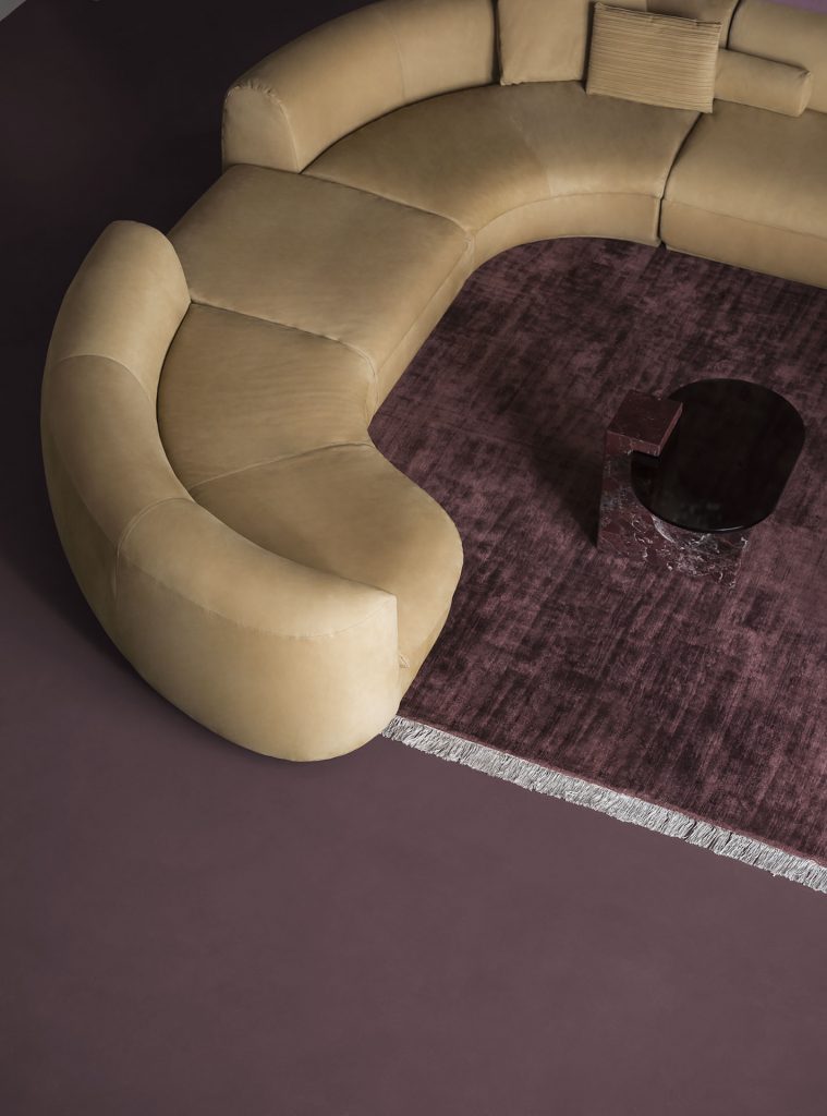 large sectional sofa made of fabric in a moztasa color tone in a living room
