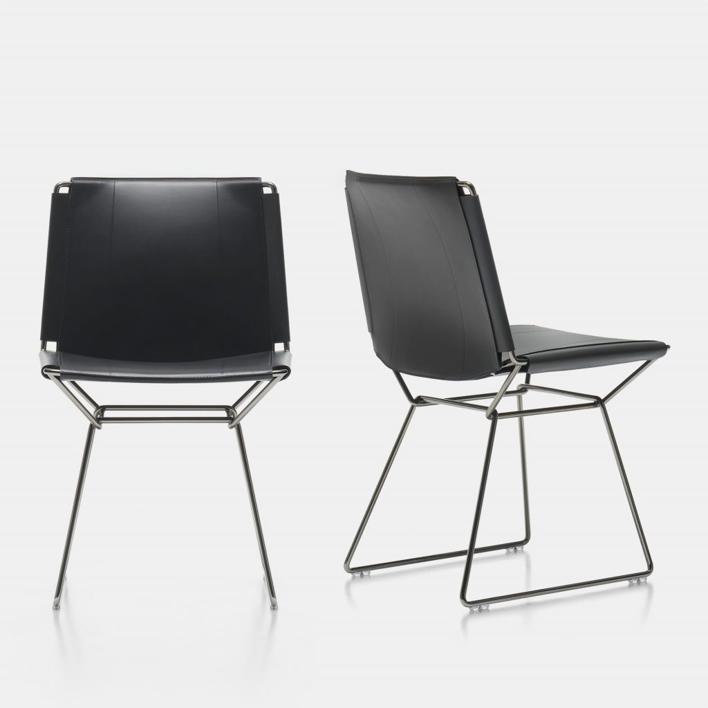 two chairs made of steel and leather seats in a brown tone on a white background