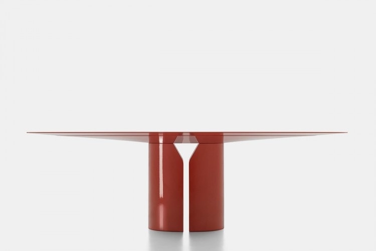 round table made of ebony throughout its structure with an opening in the middle of the base in a red tone on a white background