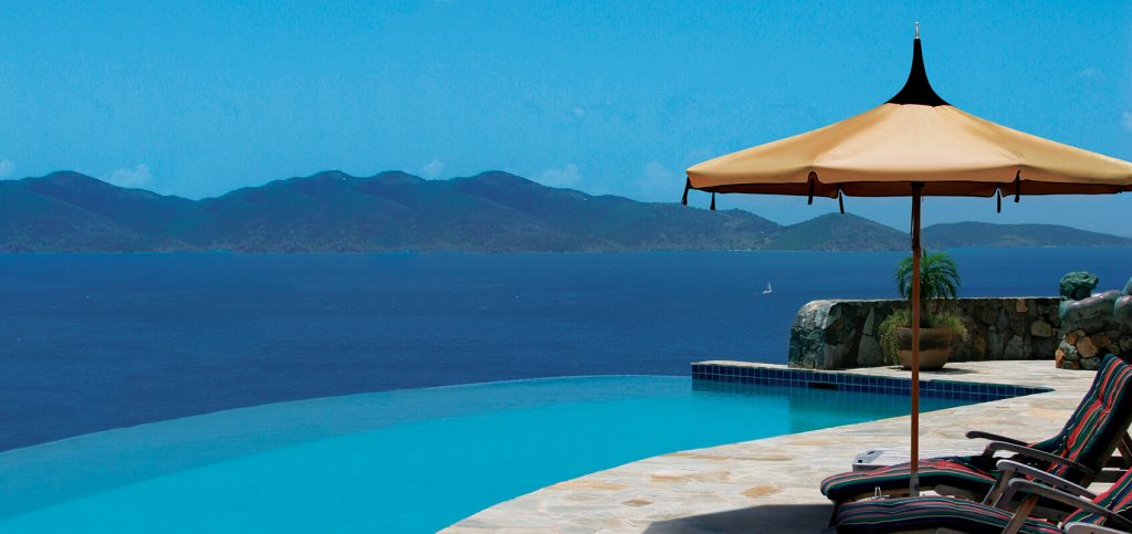 parasol in a peaked shape made of metal and fabric base in a orange color tone