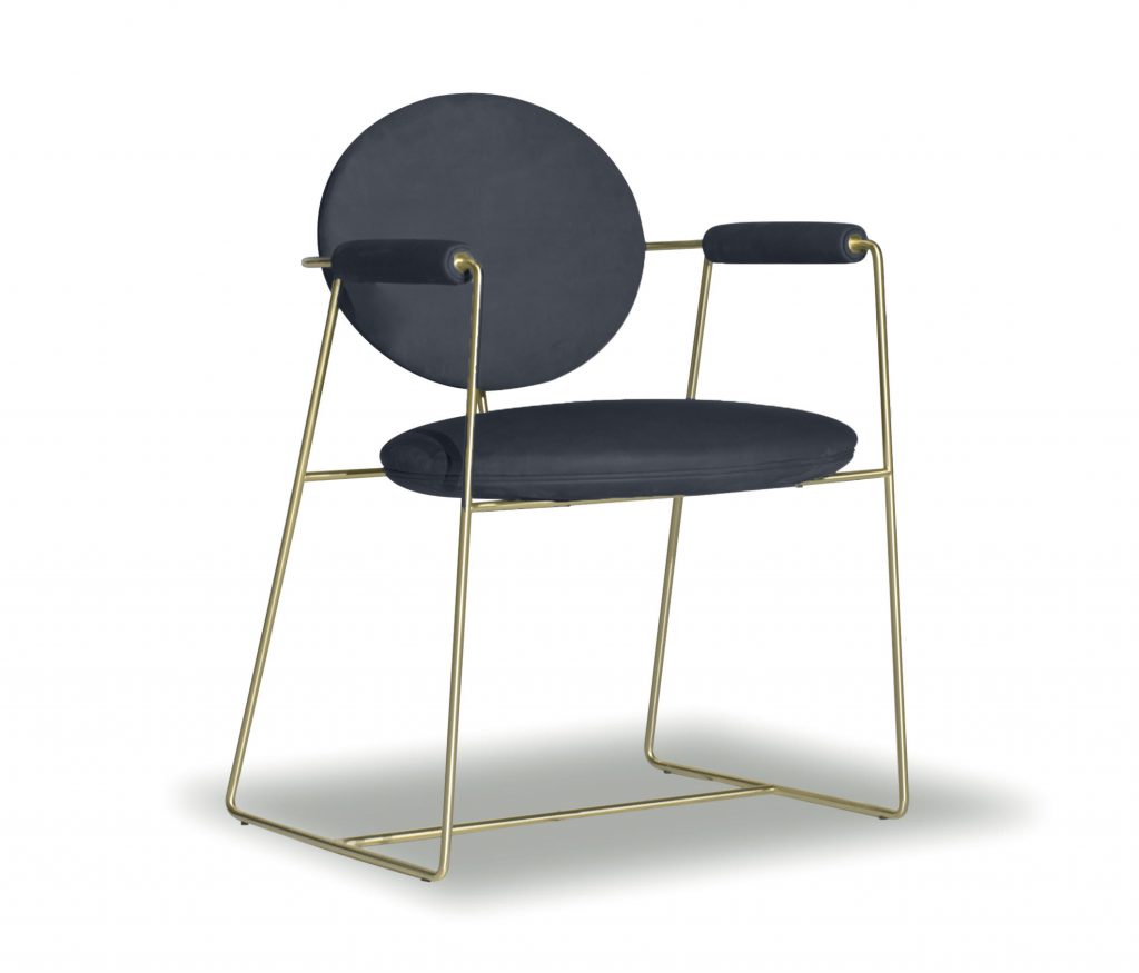 dining chair made of gray leather on metal structure finished in satin brass on a white background