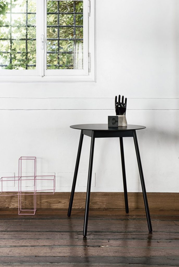 Tall side table in the shape of a circle made of a wooden base in a black tone