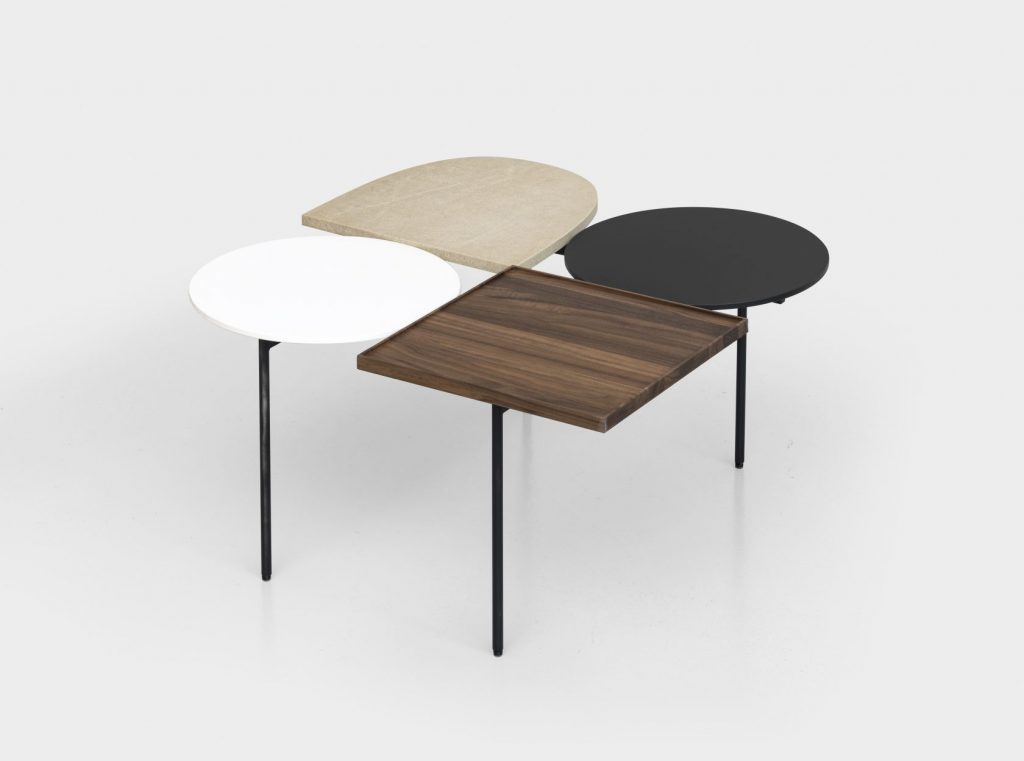 centerpiece made in geometric shapes on a metal base and wooden tops of different colors on a white background