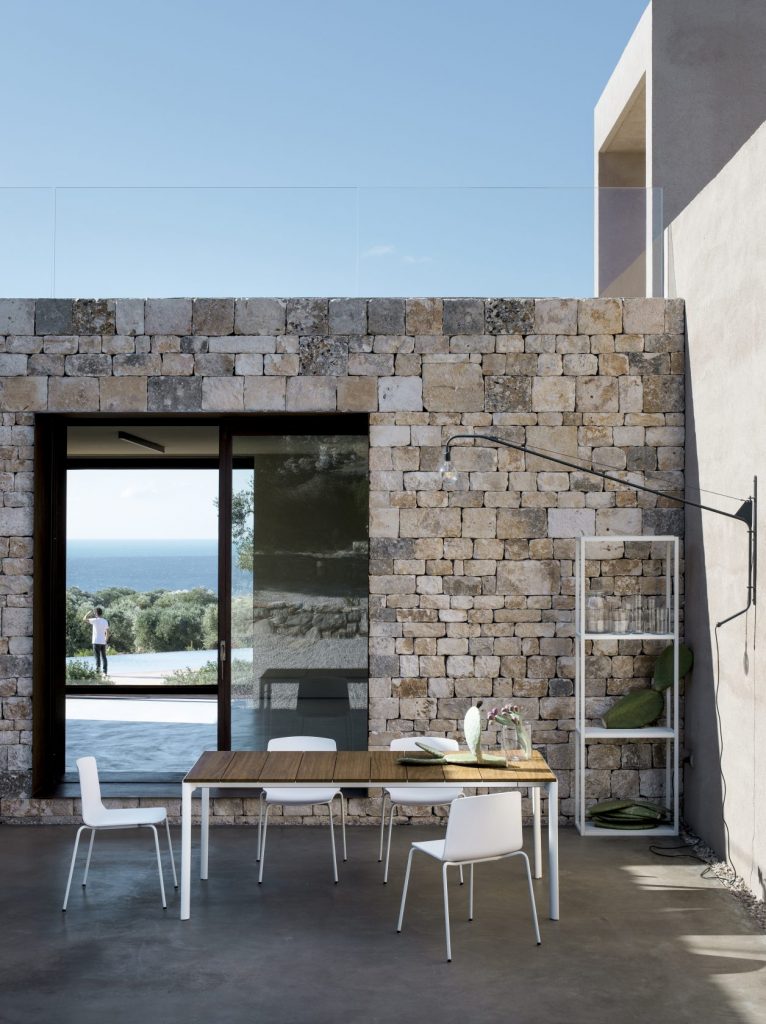 dining table made of metal or wood base and aluminum top in a white and coffe tone