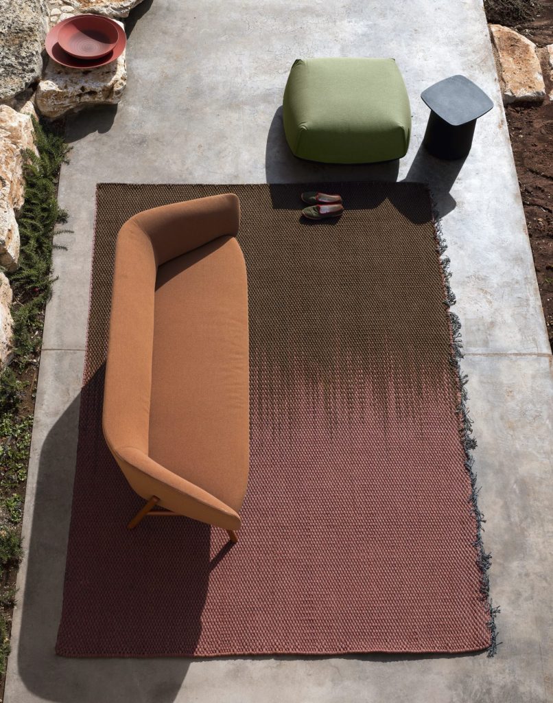 large rug made from Manuela fabric in a red tone on a living room