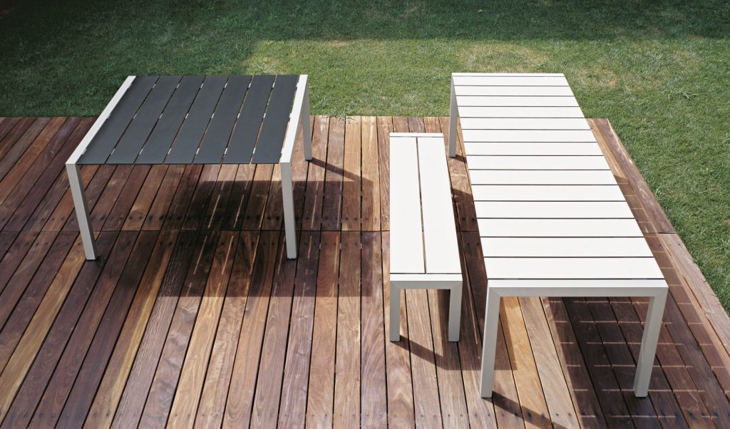 three tables made of planked wood and aluminum on its base in shades of gray and white