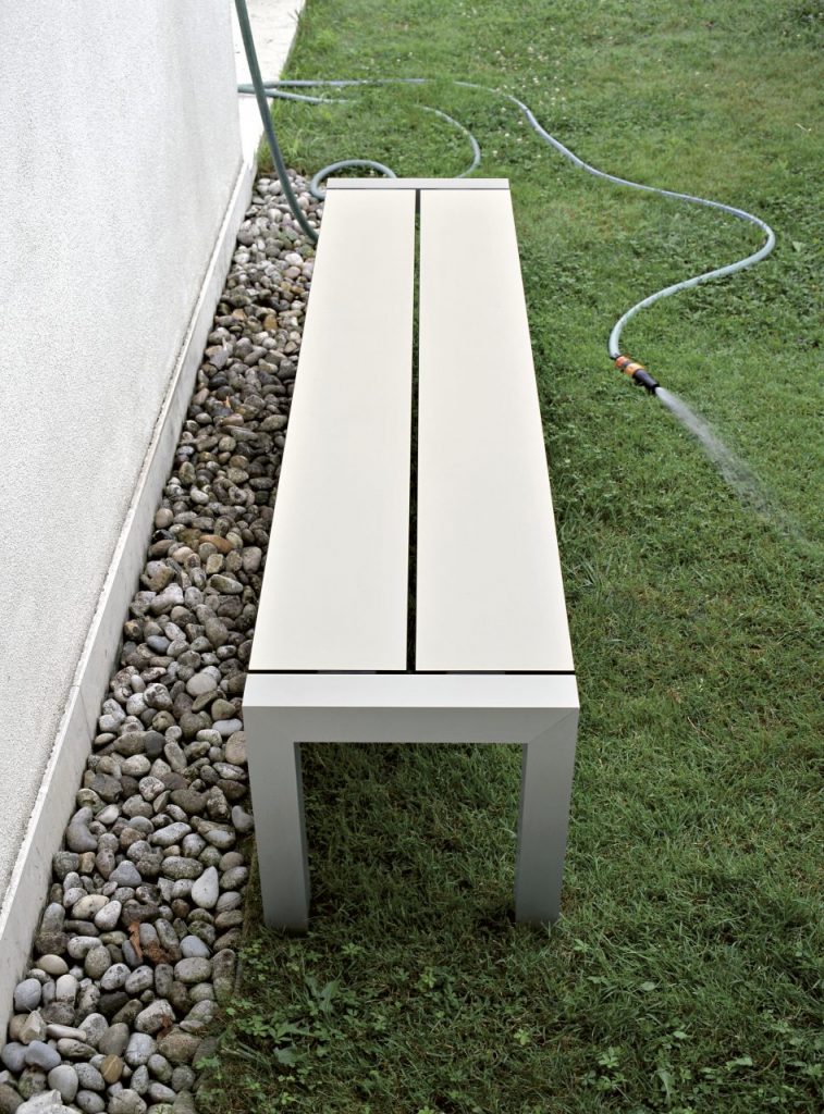 stool made by dops long wooden planks and aluminum base in a white color tone