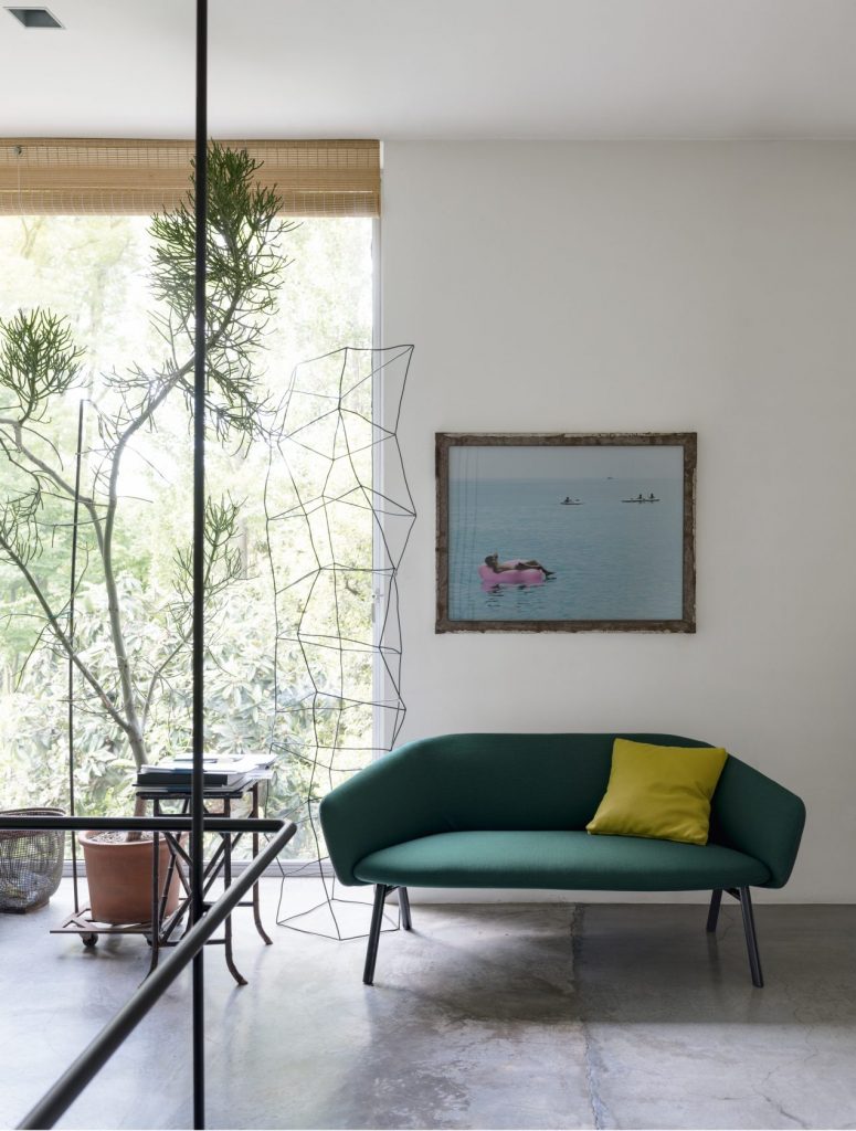 armchair made of polyurethane foam and upholstered in dark green fabric