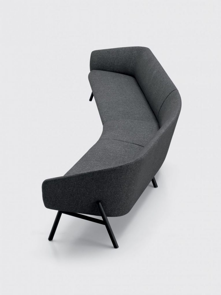 Curved sofa made of wood legs and fabric in a gray tone on a white background