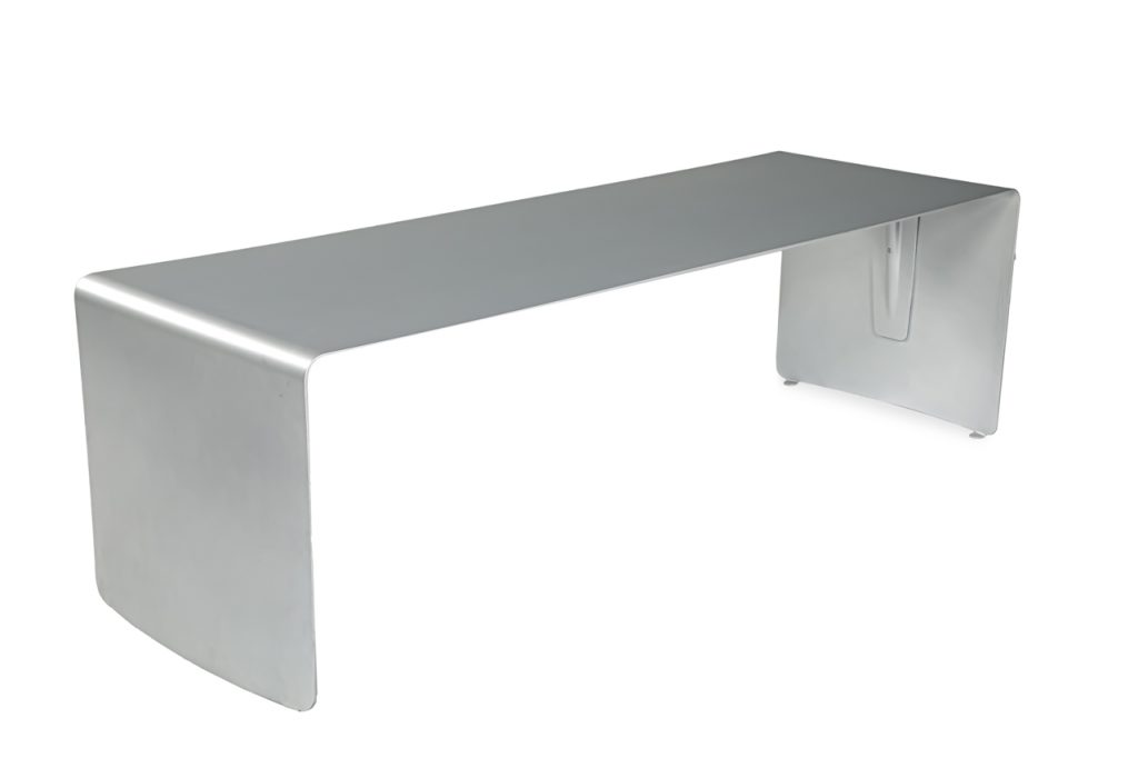 Large rectangular dining table made of a single sheet of curved aluminum with a matte lacquer finish on a white background