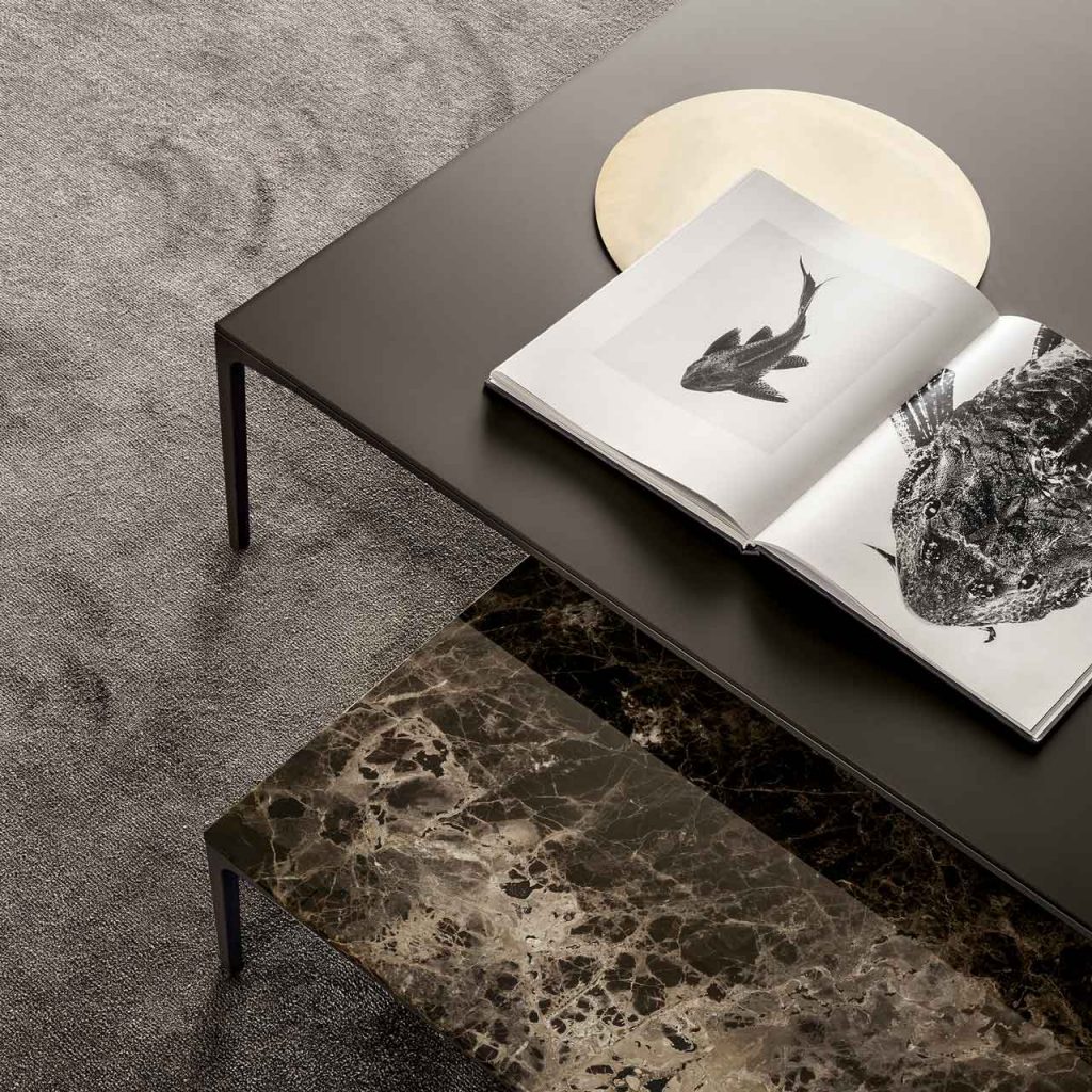 low centerpiece made of glass and glass top in a brown and black tone in a living room