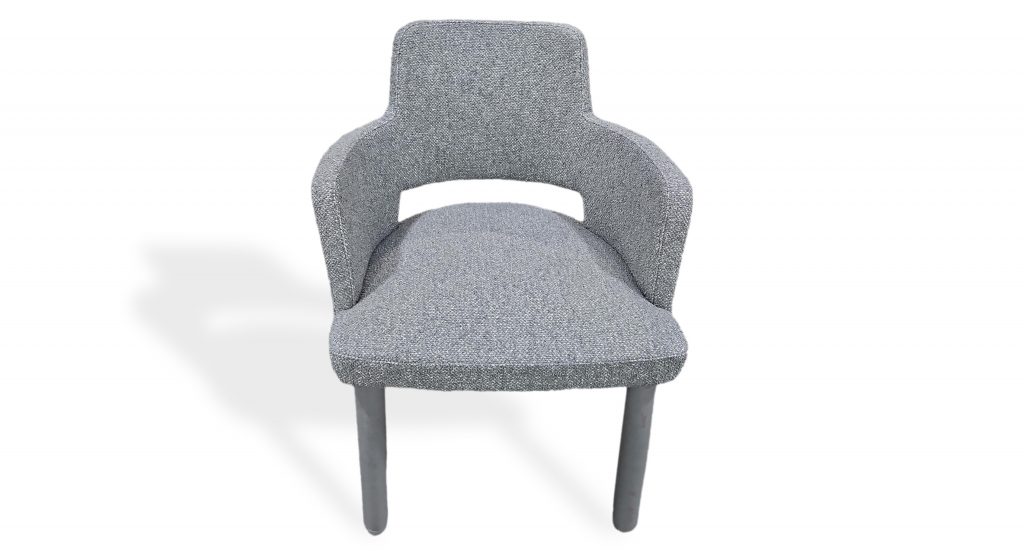 Front view showcases the chair’s softly contoured silhouette with integrated arms and a generously padded seat. Upholstered in light gray textured fabric with matching gray legs, it delivers a clean, inviting look with subtle elegance.