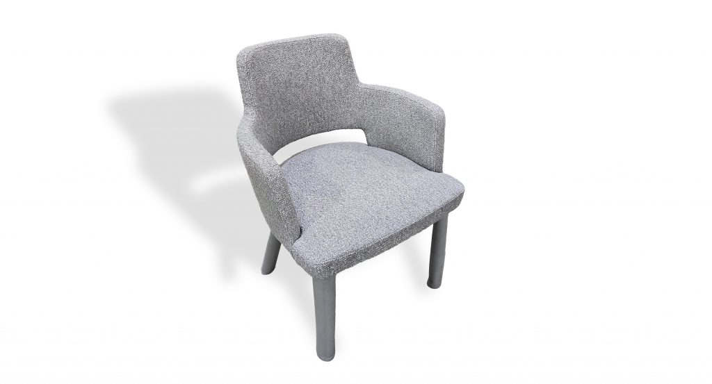 Upholstered armchair with a gently contoured silhouette and integrated armrests. Finished in light gray textured fabric with matching gray legs, it offers a refined and comfortable seating option suited for dining or lounge settings.