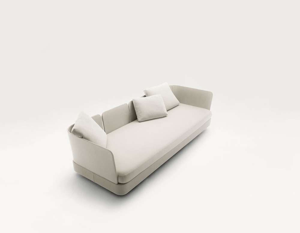 Cove outdoor modular sectional with white pillows in front of a white background