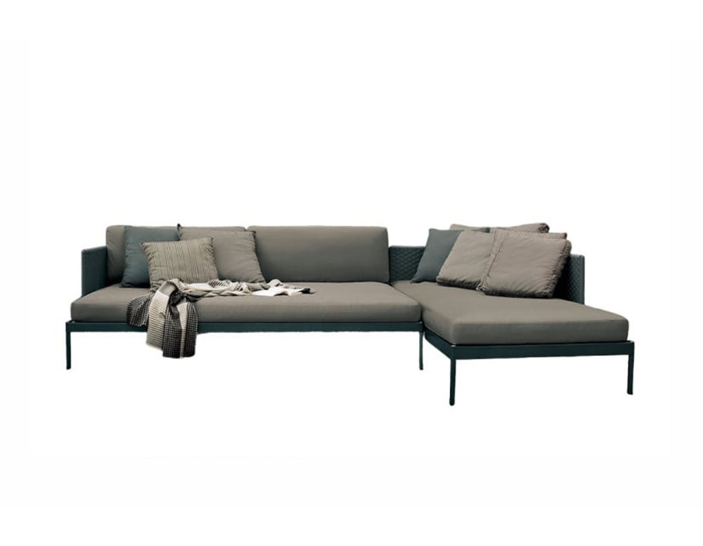 Rod Basket Sofa combines a sleek frame with generous seating and plush cushions, making it an inviting and stylish choice for open air living spaces.