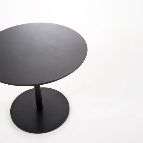 Top angled view of Button Four Table in front of a white background