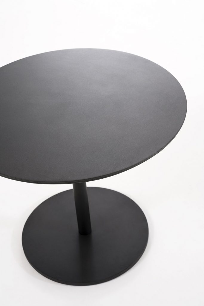 Top angled view of Button Four Table in front of a white background