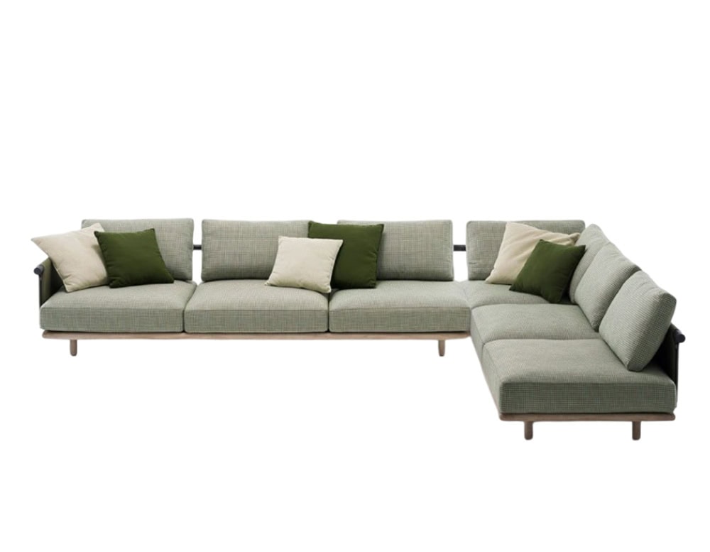 Rod Eden Sofa offers a spacious modular design with soft green-toned cushions, creating a fresh and inviting seating area for outdoor relaxation.