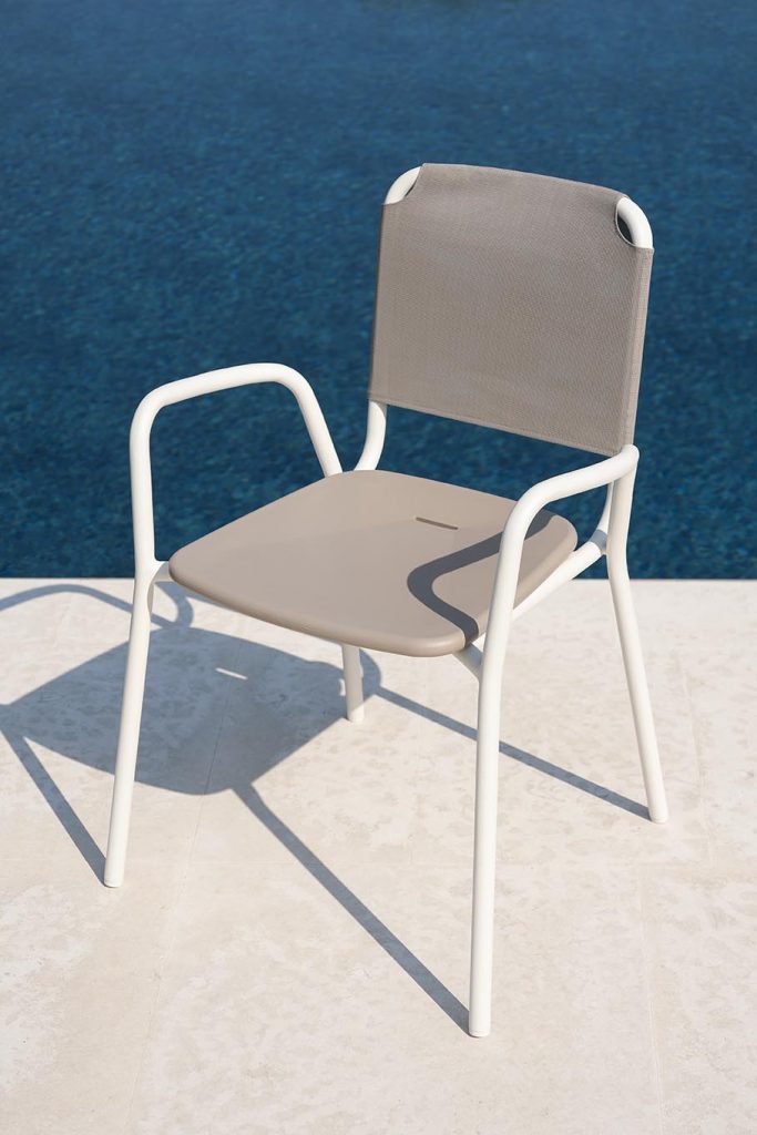 Guest One Armchair in white next to a pool