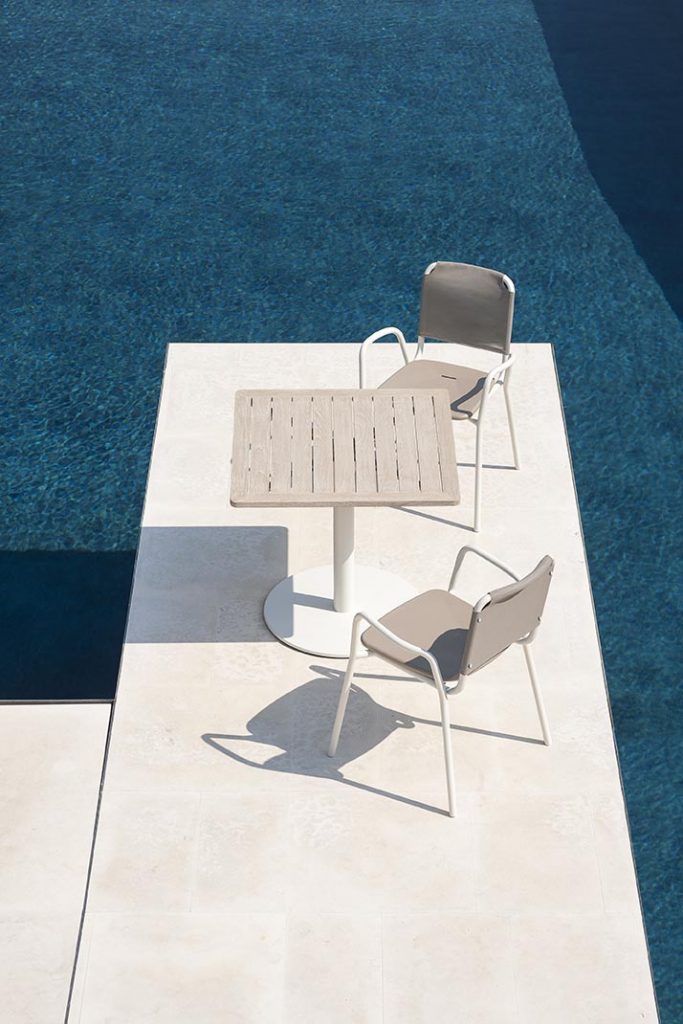 Two Guest One Armchair in white by the pool with a small square table between them