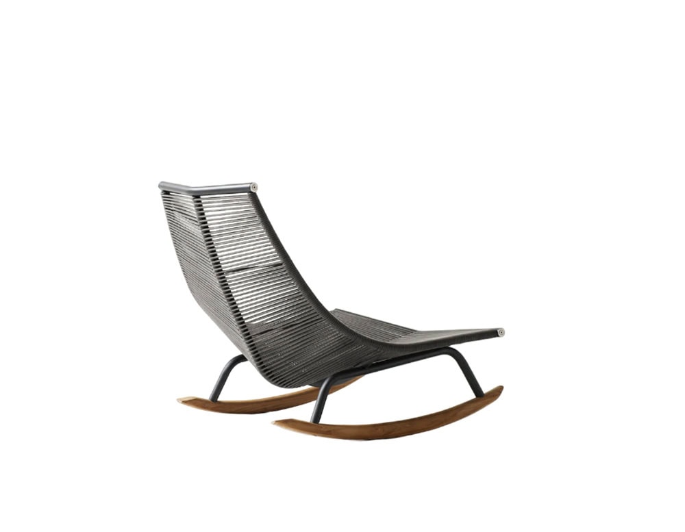 Rod Laze Chair blends a minimalist woven design with curved wooden rockers for a modern take on outdoor relaxation.