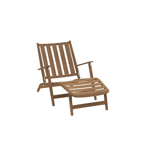 Rod Levante Lounge Chair features a classic teak build with extended support for legs, creating an inviting lounge chair perfect for open-air comfort.