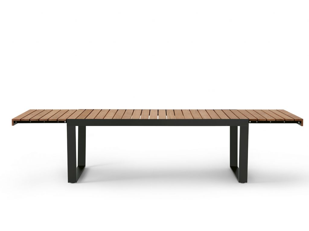 Spinnaker Thirty Four Extendable Table in a dark wood finish in the expanded position in front of a white background