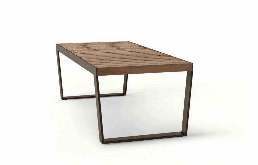 Side angled view of Spinnaker Thirty Four Extendable Table in a dark wood finish in front of a white background