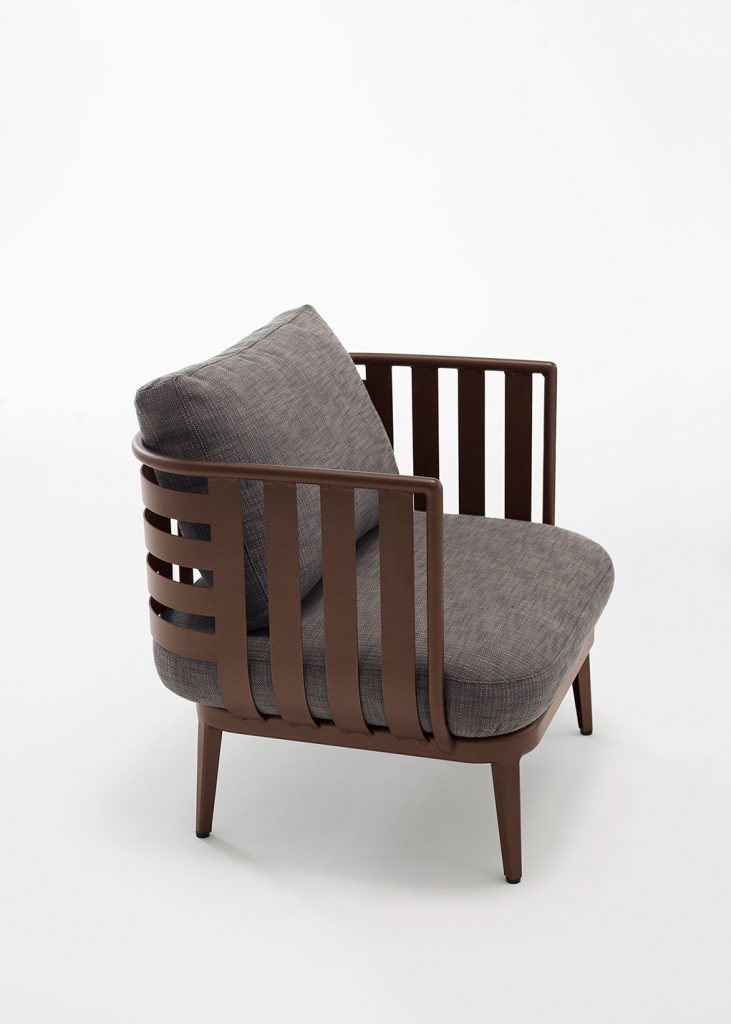 Thea One Sofa in a brown frame with a dark grey colored cushion