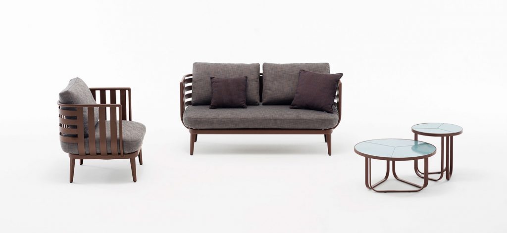 Thea Two Sofa with two coffee tables to the side in front of a white background
