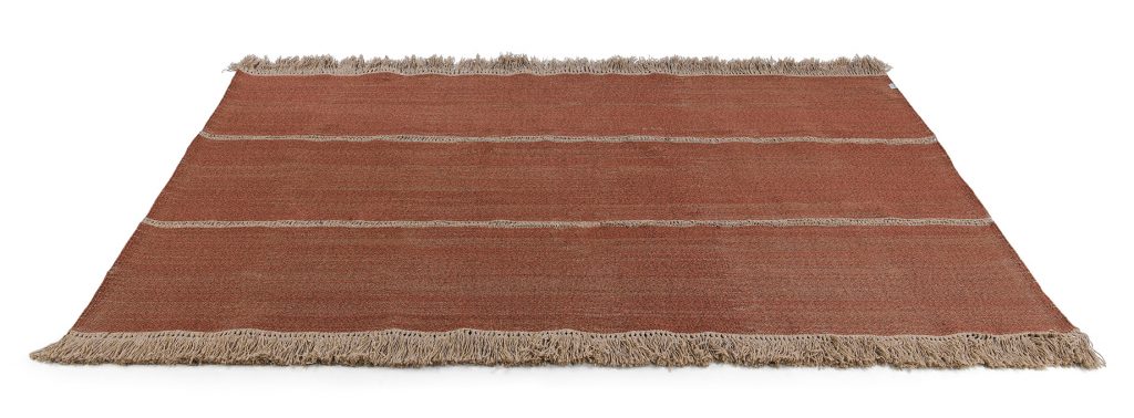 Triptyque One Rug in red color in front of a white background
