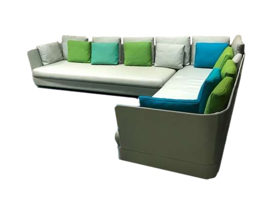 Cove outdoor modular sectional with multicolored pillows in front of a white background