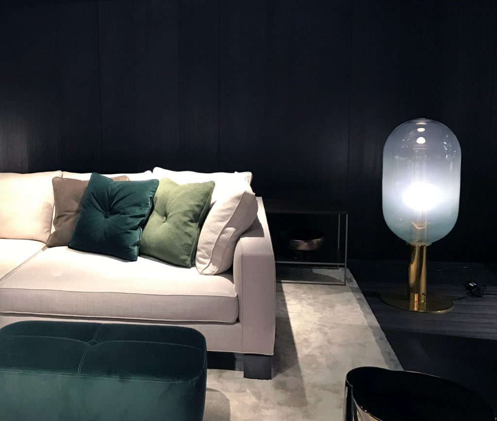 Phenomena floor lamp next to a white sofa on top of a white rug