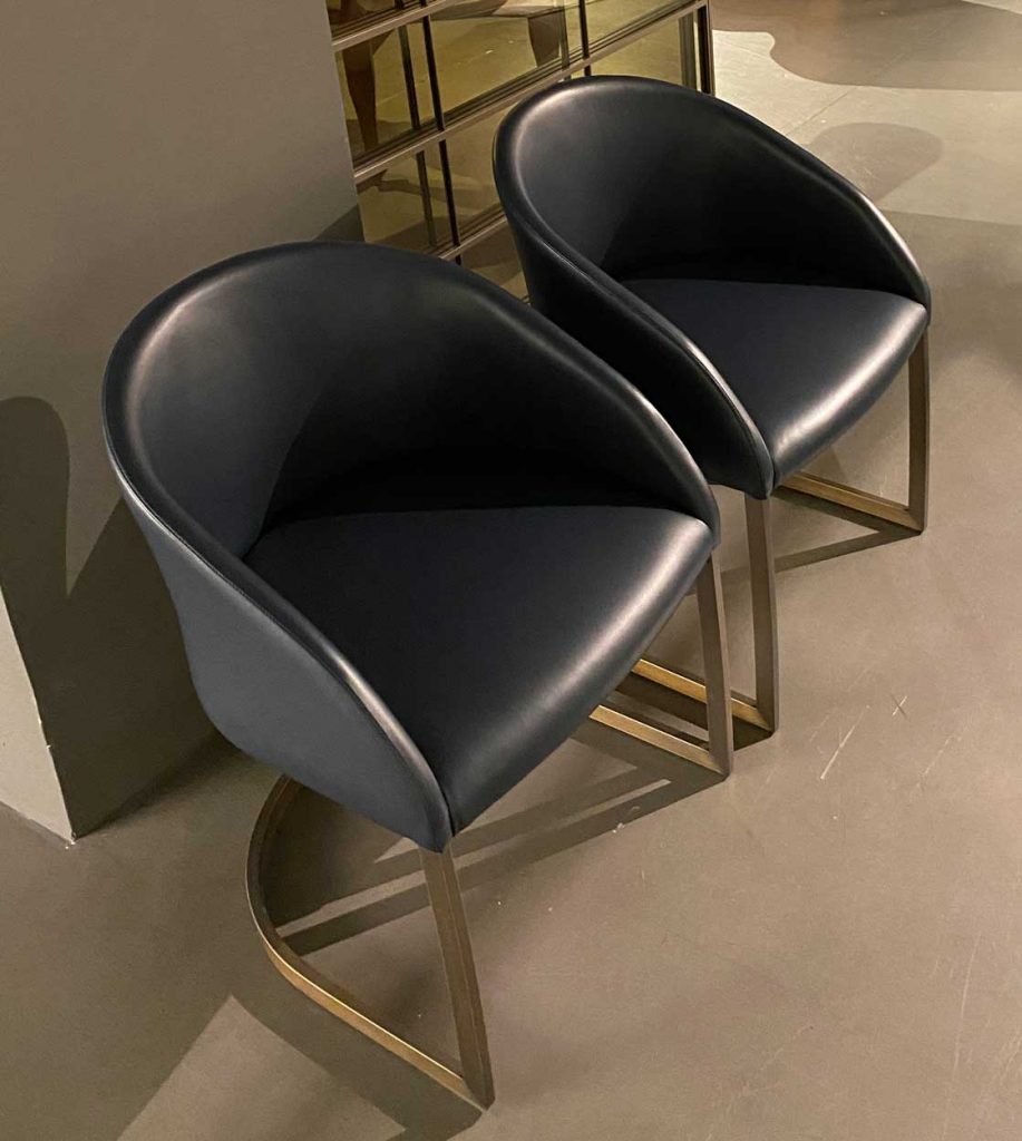 Pair of Sign armchairs side by side on carpet