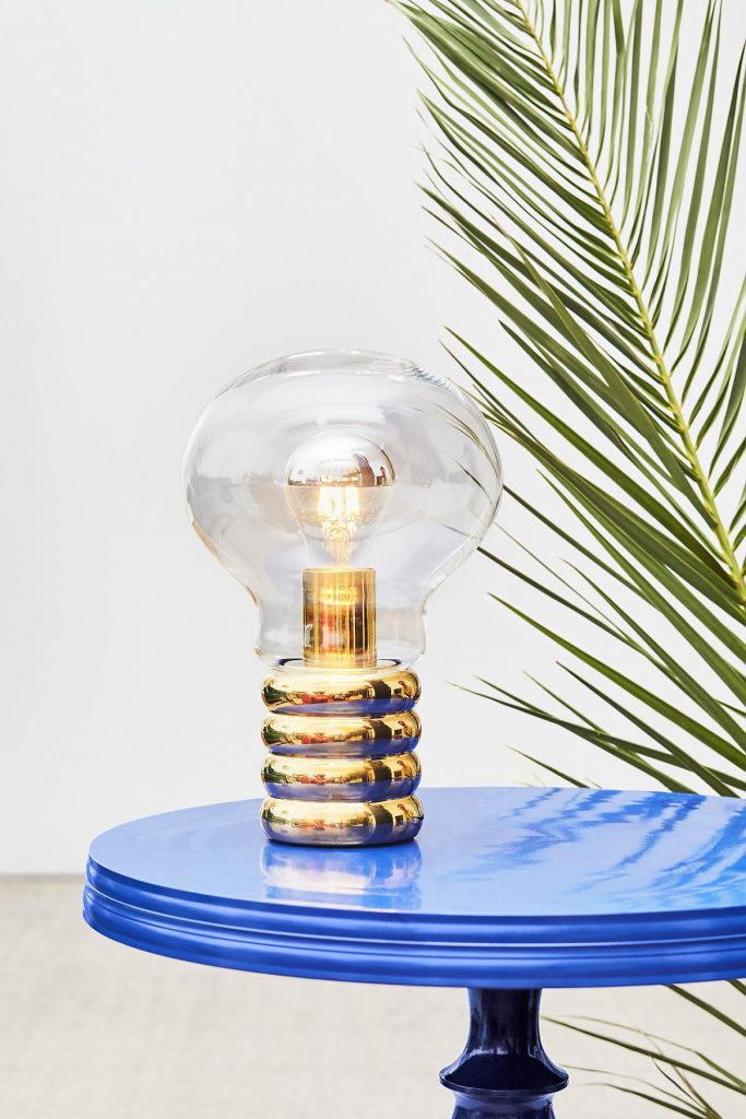 Bulb Brass sitting on a small blue table
