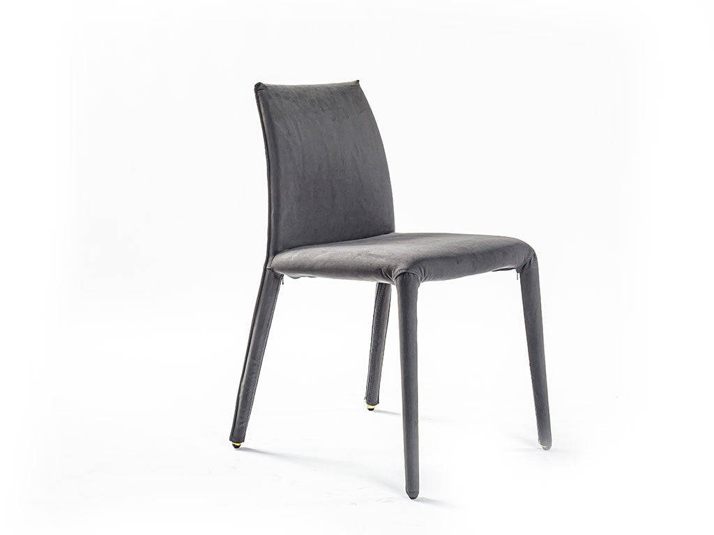 Angled view of Emi dining chair in front of a white background