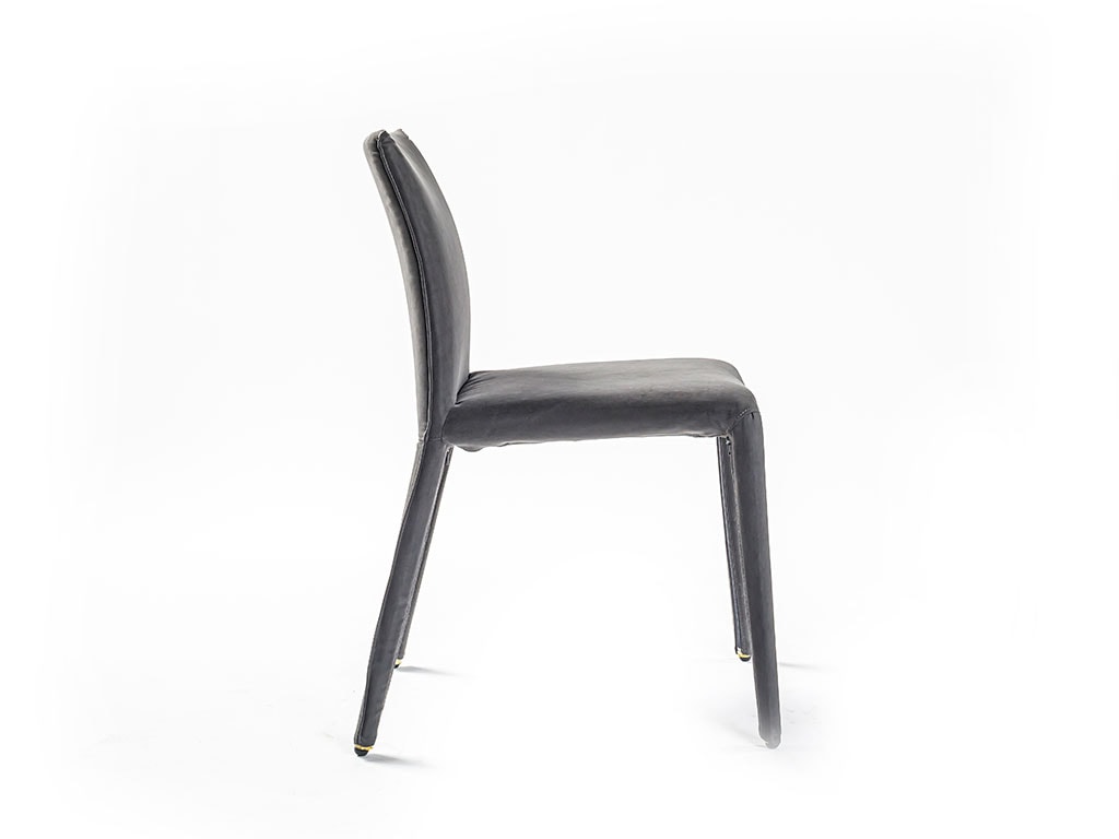 Side view of Emi dining chair in front of a white background