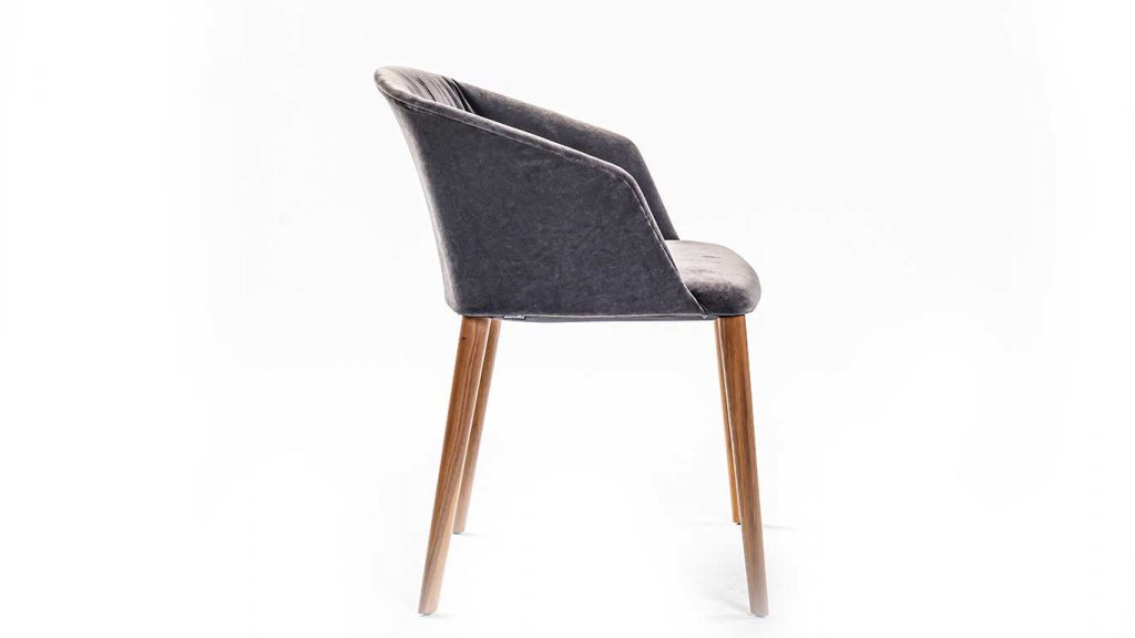 Side view of Liza dining chair in front of a white background