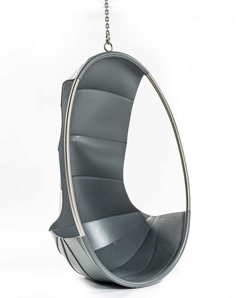 Angled view of Swing hanging chair in front of a white background